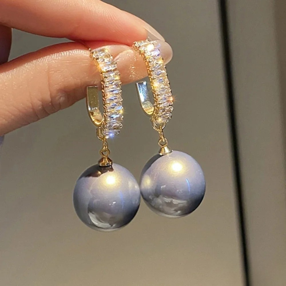 Boucles d'oreilles élégantes avec perles et zirconia