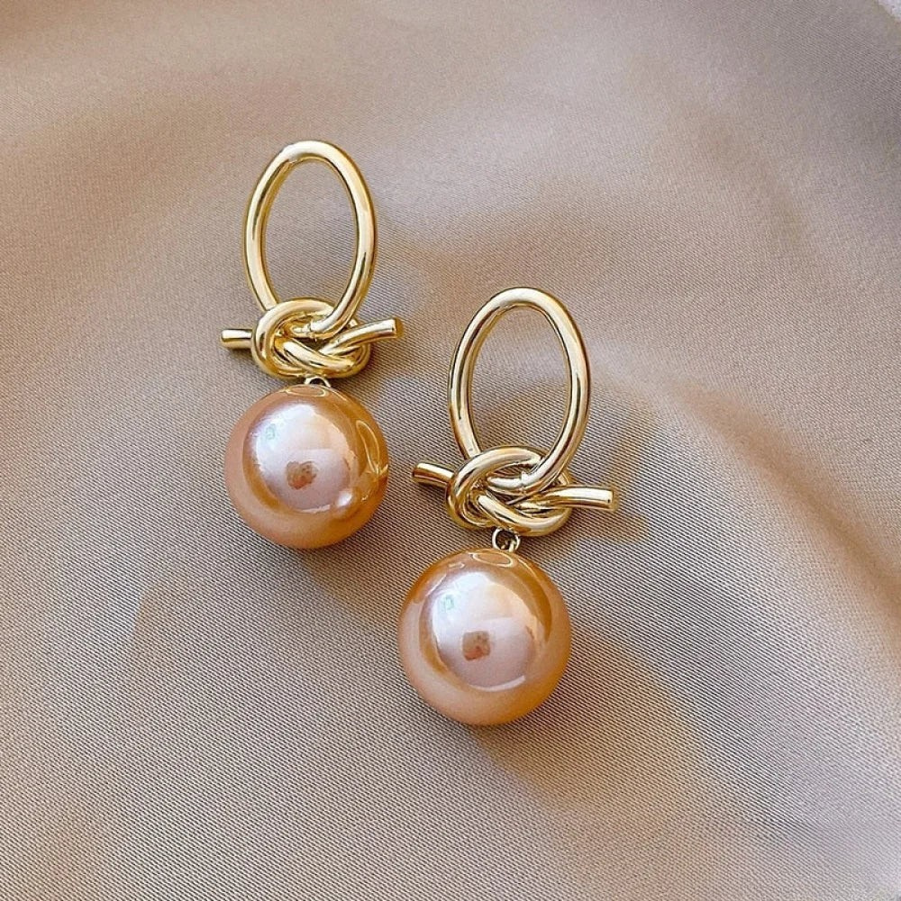 Boucles d'oreilles créoles en perles dorées